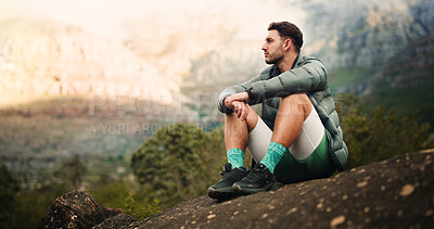 Buy stock photo Thinking, relax and man on mountain for hiking, outdoor adventure and exercise in nature. Fitness, space and calm person on break, rest and thoughtful in countryside for fresh air, wellness and hobby