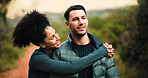 Couple, love and hug on hike, forest or bonding for adventure, think and happy in nature or fitness. Outdoor, man and embrace with woman on weekend, space or together on holiday, healthy and wellness