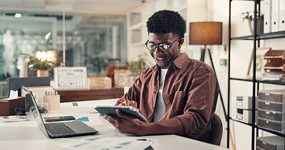 Buy stock photo Creative, black man and reading with tablet in office for research, editor feedback and review article. Journalist, digital and proofreading story, copywriting report and information for publication