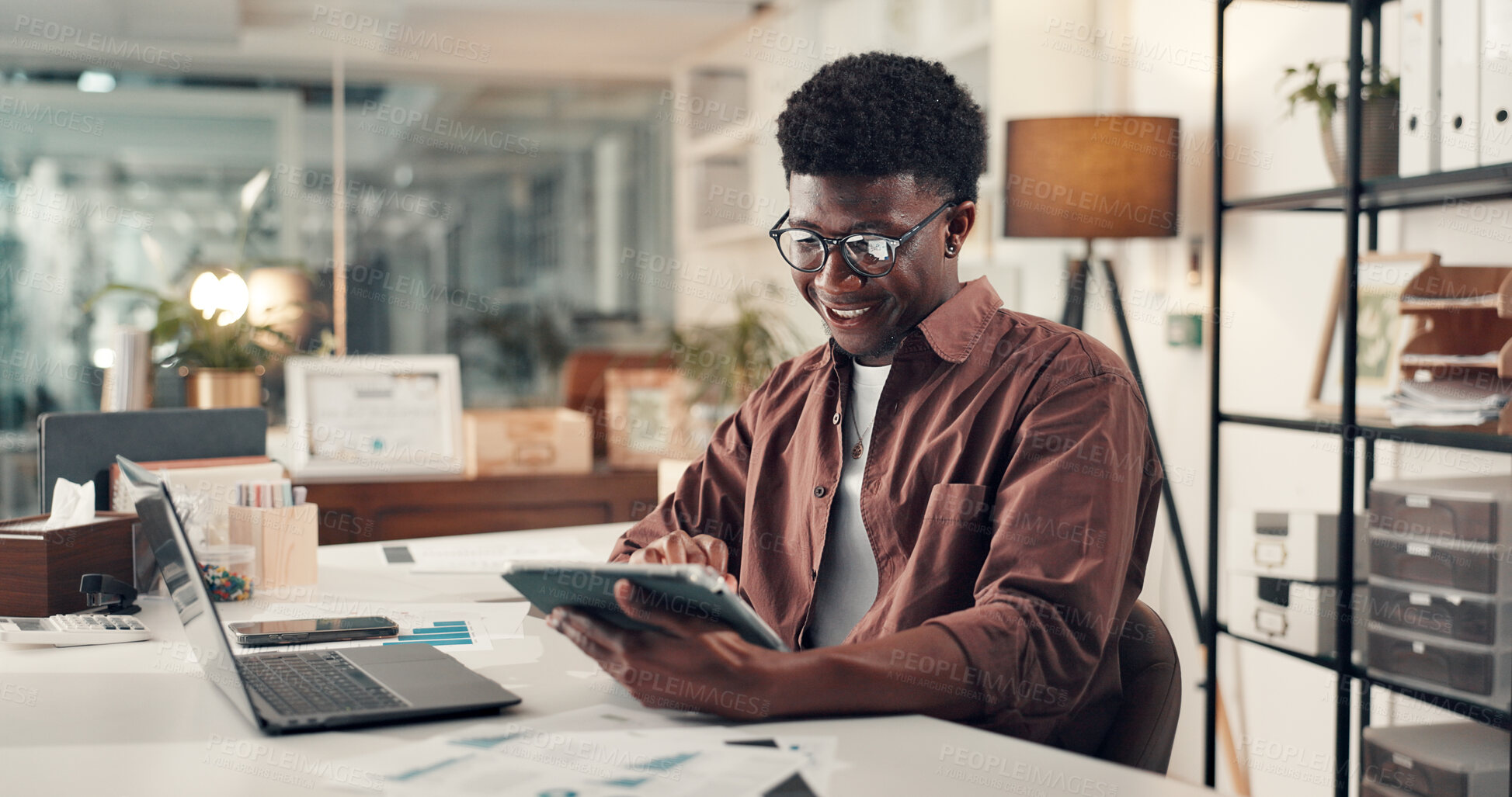 Buy stock photo Creative, black man and reading with tablet in office for research, editor feedback and review article. Journalist, digital and proofreading story, copywriting report and information for publication