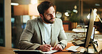 Writing, research and businessman in office at night with notes for finance report with deadline. Computer, reading and male financial manager with investment proposal for overtime in workplace.