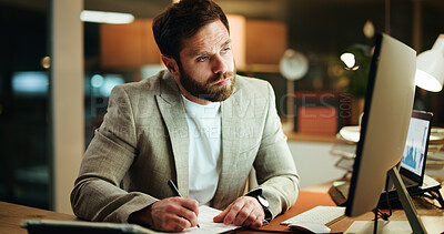 Buy stock photo Writing, notes and businessman in office at night with research for finance report with deadline. Computer, reading and male financial manager with investment proposal for overtime in workplace.