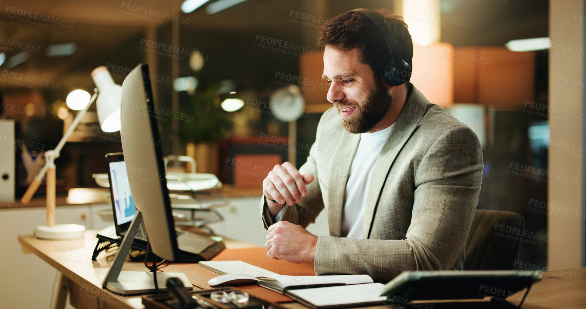 Buy stock photo Businessman, night and broker with headphones in office for finance advice or data analysis. Man, financial advisor or working late with computer for company performance or analytics in workplace