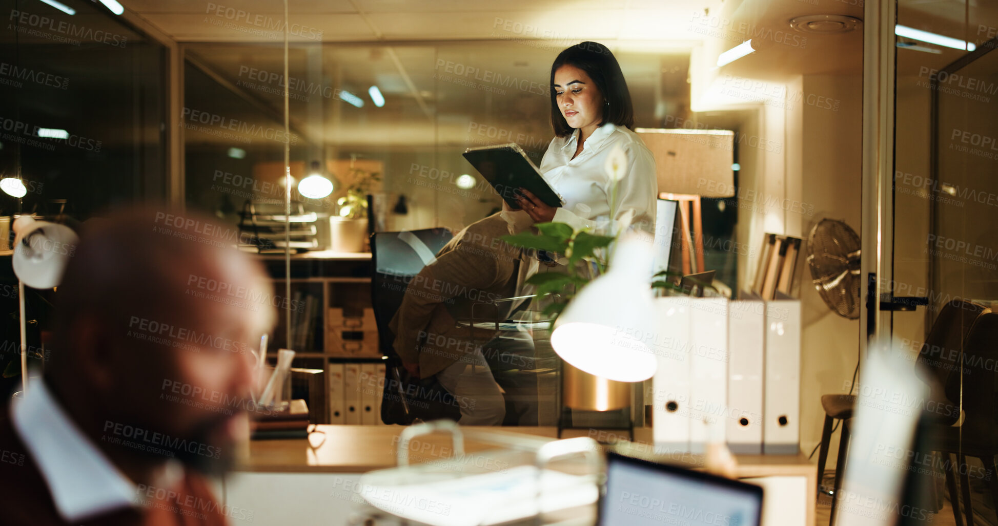 Buy stock photo Business woman, tablet and night in office for reading, financial portfolio update or trader info online. Coworking, finance broker and tech for investment report, stock market research and deadline