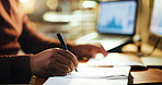 Writing, night and hand in office with closeup, business journal and technology in workplace. Professional, person and schedule in corporate company with planning, notebook and computer at desk.