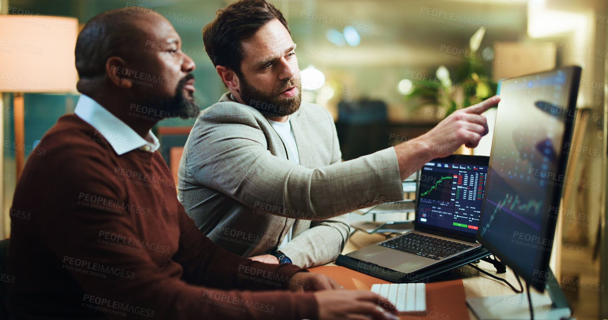 Buy stock photo Pointing, stock market and computer screen with business people in office for trading, night and graph. Broker, partnership and investment chart with employees for account growth and overtime