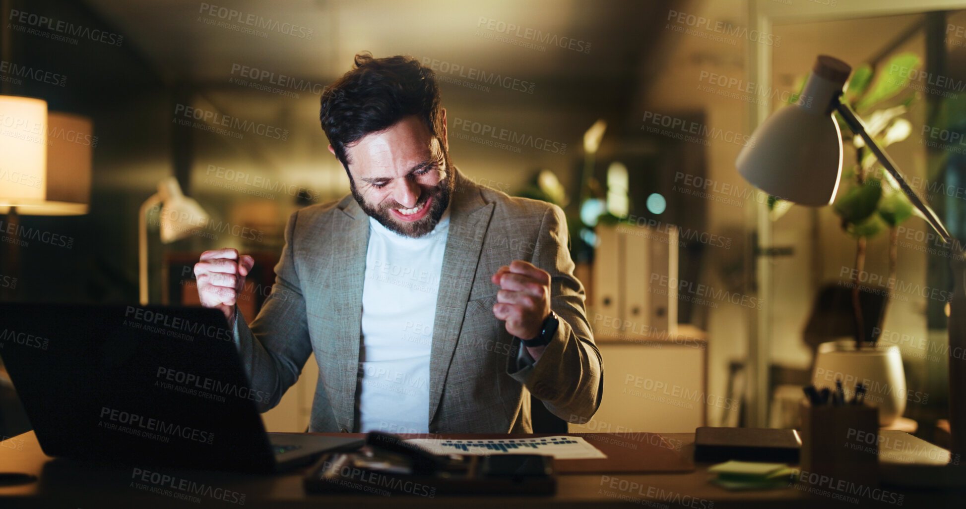 Buy stock photo Excited, businessman and night with fist pump on laptop for winning, investment or promotion at office. Happy, man or employee working late with smile, graphs and good news or celebration for bonus