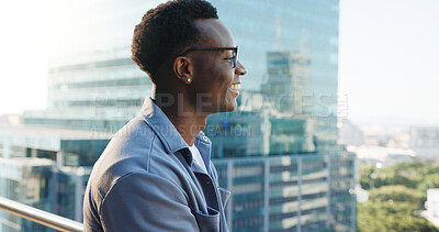 Buy stock photo Thinking, employee and man with smile, city and screenwriter with ideas for career path or creative. Balcony, reflection and black person with vision of future, space and intern with opportunity