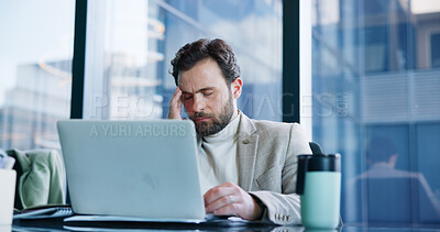 Stress, headache and business man on laptop with online mistake, bad news and finance crisis in office. Professional, corporate and worker with burnout for bankruptcy, investment problem and failure