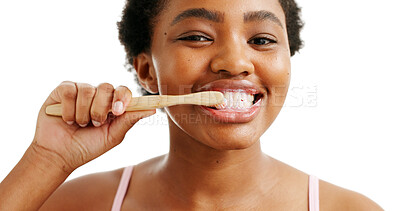 Buy stock photo Brushing teeth, organic dental care and portrait of black woman in studio for oral hygiene and wellness. Cleaning, smile or person with tooth whitening, bamboo toothbrush or happy on white background