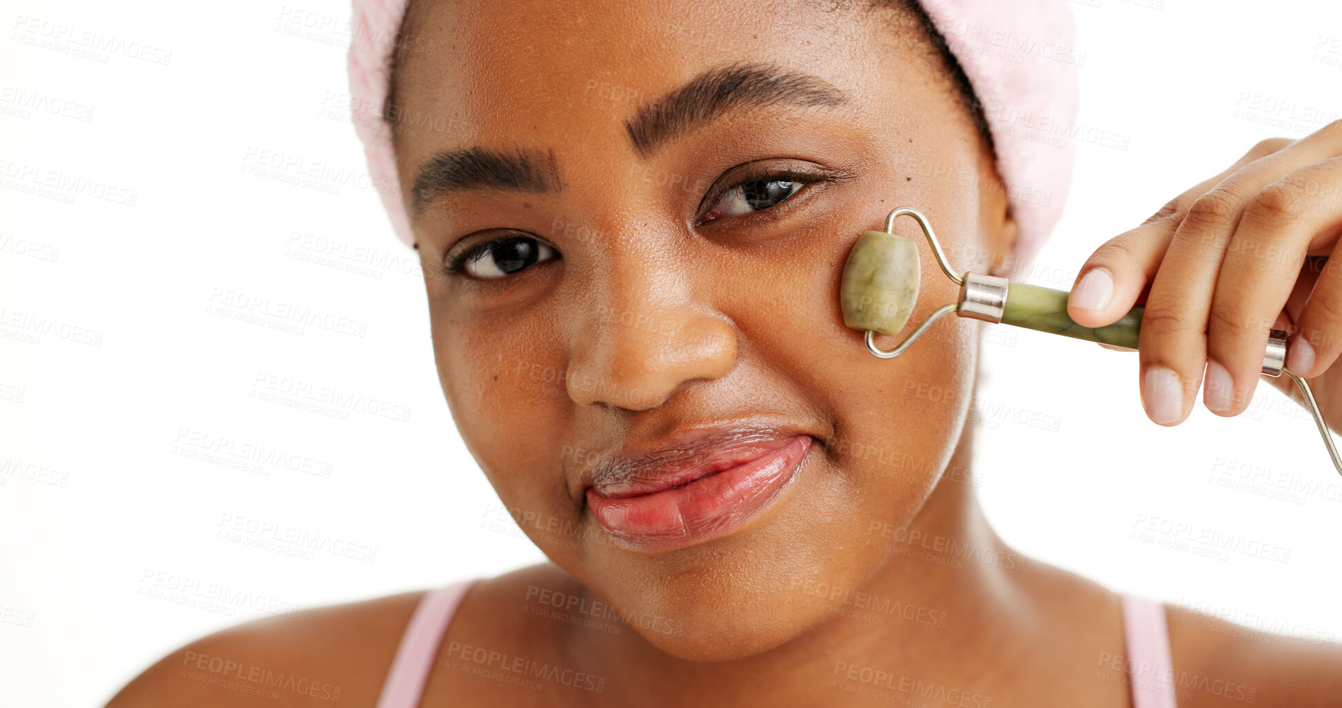 Buy stock photo Black woman, jade roller and smile in studio portrait, beauty and circulation on white background. African girl, happy and facial massage for skincare, dermatology and lymphatic drainage in Nigeria