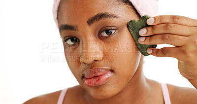 Buy stock photo Gua sha, portrait and skincare with black woman in studio for circulation, drainage or massage. Beauty, facial and jade stone with person isolated on white background for aesthetic wellness routine