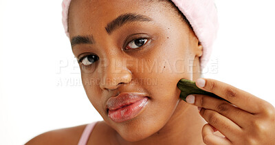 Buy stock photo Black woman, gua sha and beauty in studio portrait, tools and circulation on white background. African girl, wellness and facial massage for skincare, dermatology or lymphatic drainage in Nigeria