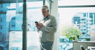 Phone, mature and reading with business man in office for magazine subscription, client survey and research. Engagement tracking, newsletter poll and editor proposal with person in media agency