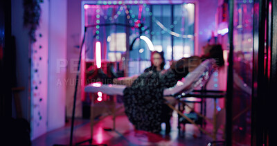 Buy stock photo Blur, tattoo and artist with client in studio for artwork design, aesthetic and body art culture. Permanent ink parlour, customer and creative process with people for small business and neon light