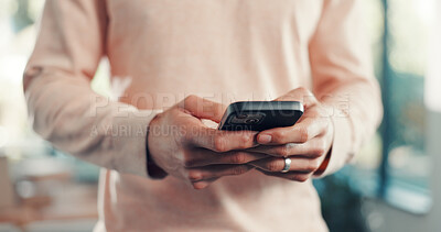 Buy stock photo Cellphone, hands and man in home with networking, communication or chatting on mobile app. Technology, typing and male person with phone for email, texting and social media online in apartment.