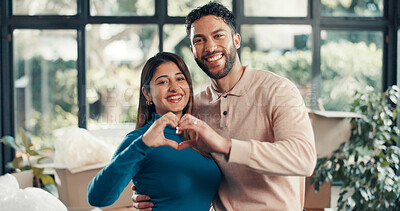 Buy stock photo Heart hands, portrait and moving with couple in new home for property investment, love and partner. Hug, real estate growth and homeowner purchase with man and woman in house for relocation and rent