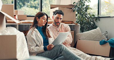 Buy stock photo Documents, boxes and couple in new home for planning mortgage, property or investment deal. Paperwork, reading and man with woman for real estate information by cardboard in apartment together.