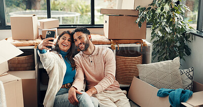 Buy stock photo Happy couple, selfie and new house with hug, boxes or memory on floor with web post for moving. Man, woman and embrace for photography, care and social media for real estate investment at property