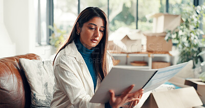 Buy stock photo New home, reading and woman on sofa, relax and knowledge with rental agreement. Apartment, property owner and person on couch, lease and tenant with mortgage contract, relocation and information