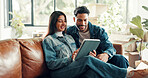 Couple, smile and tablet with research in new home for online shopping, renovation and boxes. Excited, man and woman with technology on sofa for relocation, decor app or moving in house together