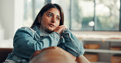 Buy stock photo Thinking, mental health and woman in home with sofa, reflection or memory of past trauma. Grief, flashback and Indian female in living room with couch, anxiety trigger or fatigue in emotional thought