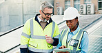 Planning, solar energy and tablet with construction worker people on roof of building in city. App, collaboration and engineering team outdoor for installation or inspection of photovoltaic panels