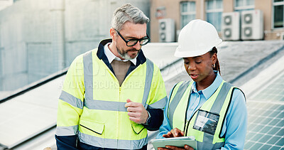 Buy stock photo Planning, solar energy and tablet with construction worker people on roof of building in city. App, collaboration and engineering team outdoor for installation or inspection of photovoltaic panels