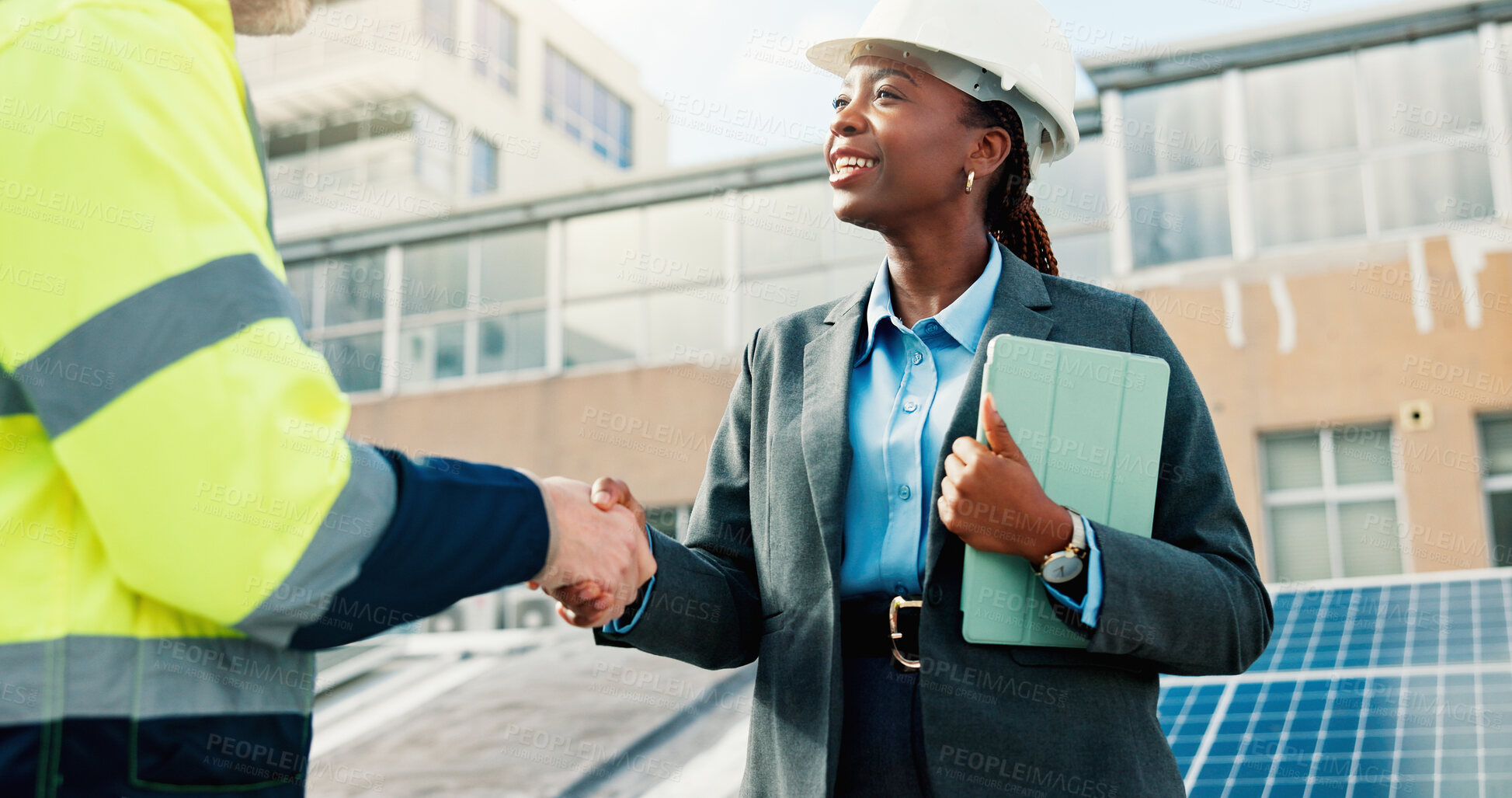Buy stock photo Happy woman, engineer and handshake with team for solar power project, maintenance or deal in city. Female person, technician or employees shaking hands for sustainable plan or renewable energy