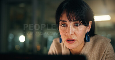 Buy stock photo Business, night and woman in office, laptop and online reading for news report. Mature person, evening and journalist in workplace, pc and research for article, copywriting or deadline for submission