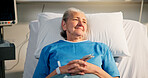 Smile, woman and senior patient in hospital for recovery of surgery, diagnosis or treatment. Happy, rest and elderly female person in bed for medical consultation or appointment in ward at clinic.