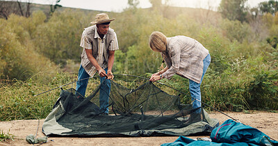 Buy stock photo Couple, tent or setting campsite with rods in forest for outdoor stay, adventure or travel together. Man, woman or campers with equipment or preparation for safety shelter or protection in wilderness
