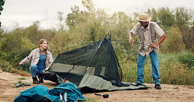Buy stock photo Tent, help and couple with nature, camping and assistance with adventure, support and cooperation. Teamwork, man and woman with preparation, setting up or environment with campsite or break in Canada