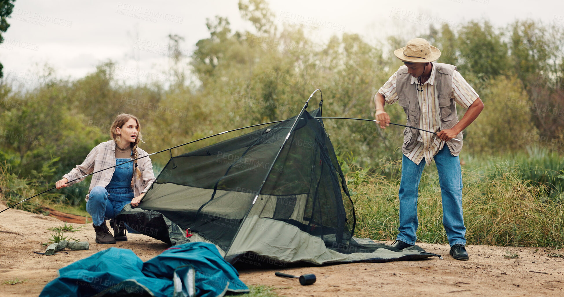 Buy stock photo Tent, help and couple with nature, camping and assistance with adventure, support and cooperation. Teamwork, man and woman with preparation, setting up or environment with campsite or break in Canada