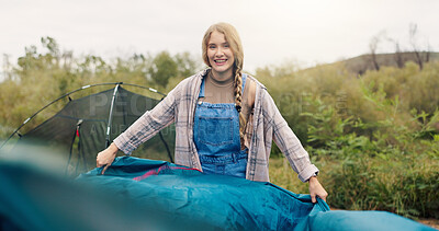 Buy stock photo Camping, woman and pitch tent in nature for weekend break, holiday adventure or preparation. Countryside, portrait and person setting up shelter at campsite for travel vacation or assemble equipment