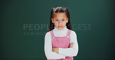 Buy stock photo Portrait, arms crossed and child with anger in studio, serious or grumpy attitude with mockup space. Frustrated girl, kid and upset student with negative mood, emoji or expression on green background