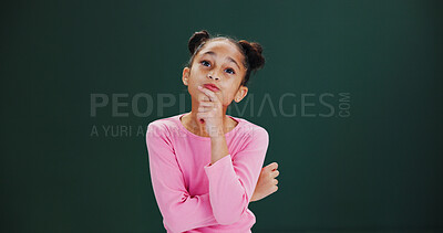 Buy stock photo Thinking, ideas and child in studio with solution, choice or decision by mockup space with memory. Dreaming, problem solving and girl kid with brainstorming or planning expression by green background