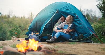 Buy stock photo Happy couple, tent and relax with fire for camping, outdoor vacation or holiday together in nature. Man, woman or love with smile, flame or shelter for safety, security or protection in wilderness