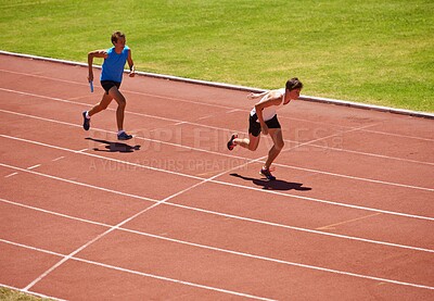 Buy stock photo Athlete, running and race track with relay and teamwork at stadium, fitness and workout outdoor. People in arena, runner and exercise with sports, trust and support for challenge, speed and action