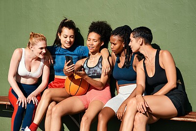 Buy stock photo Basketball, friends and girls with phone for sports, social media or show game results online. Mobile, ball and group of women outdoor together on training break, fitness and team exercise on bench