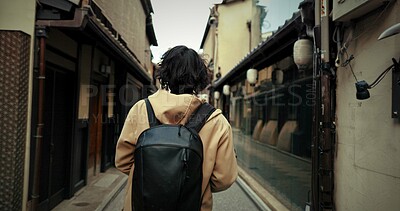 Buy stock photo Travel, man and backpack in Japan with vacation, adventure and holiday with back outdoor in city. Urban road, journey and person walking in town with Japanese architecture Hanamikoji Street of Kyoto