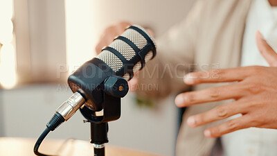 Buy stock photo Hands, person and speaking with mic for podcast, audio broadcast and live recording in studio. Closeup, presenter and hosting talk show for media production, content creator and radio announcement