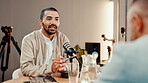 Podcast, mic and people with guest in studio for interview, conversation and broadcast for radio show. Content creation, hosting and presenter with man for recording, live stream or talking for media