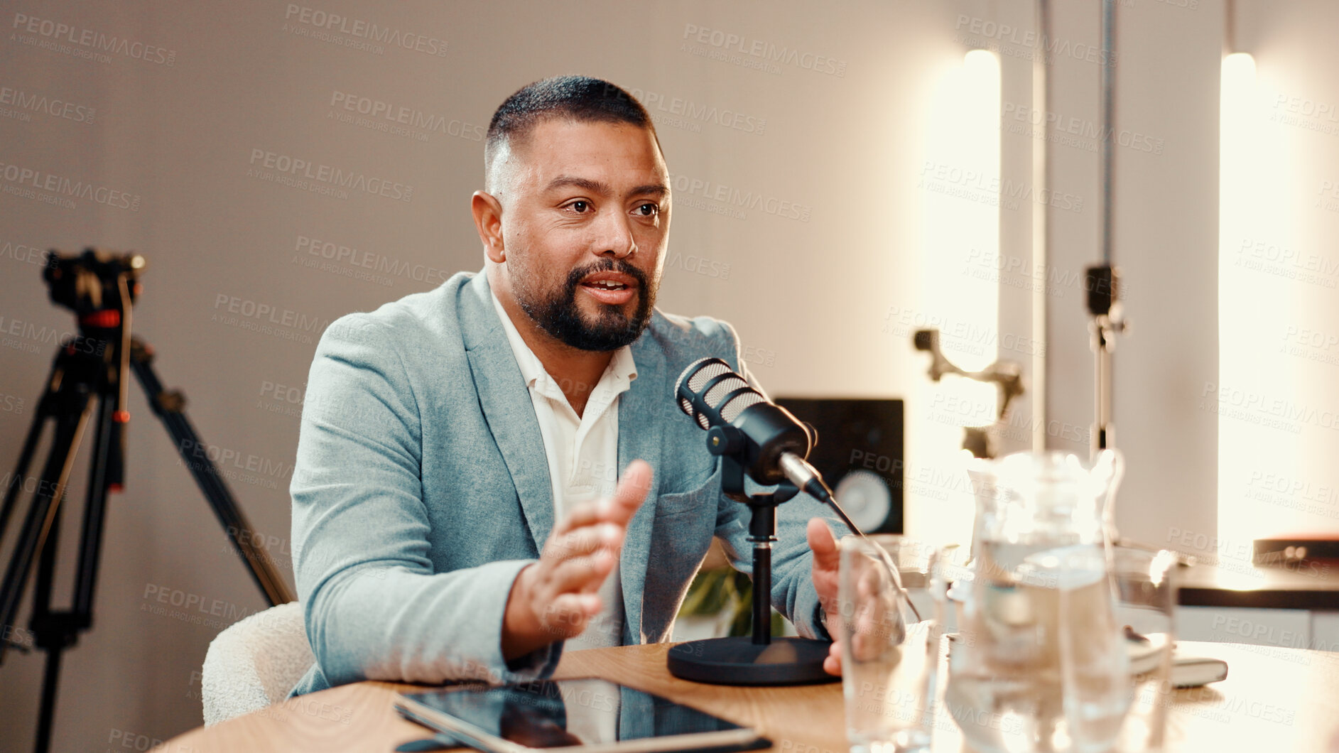 Buy stock photo Conversation, microphone and podcast with man in studio for broadcast, interview or live streaming. Radio, subscription entertainment and talk show with host in production office for recording