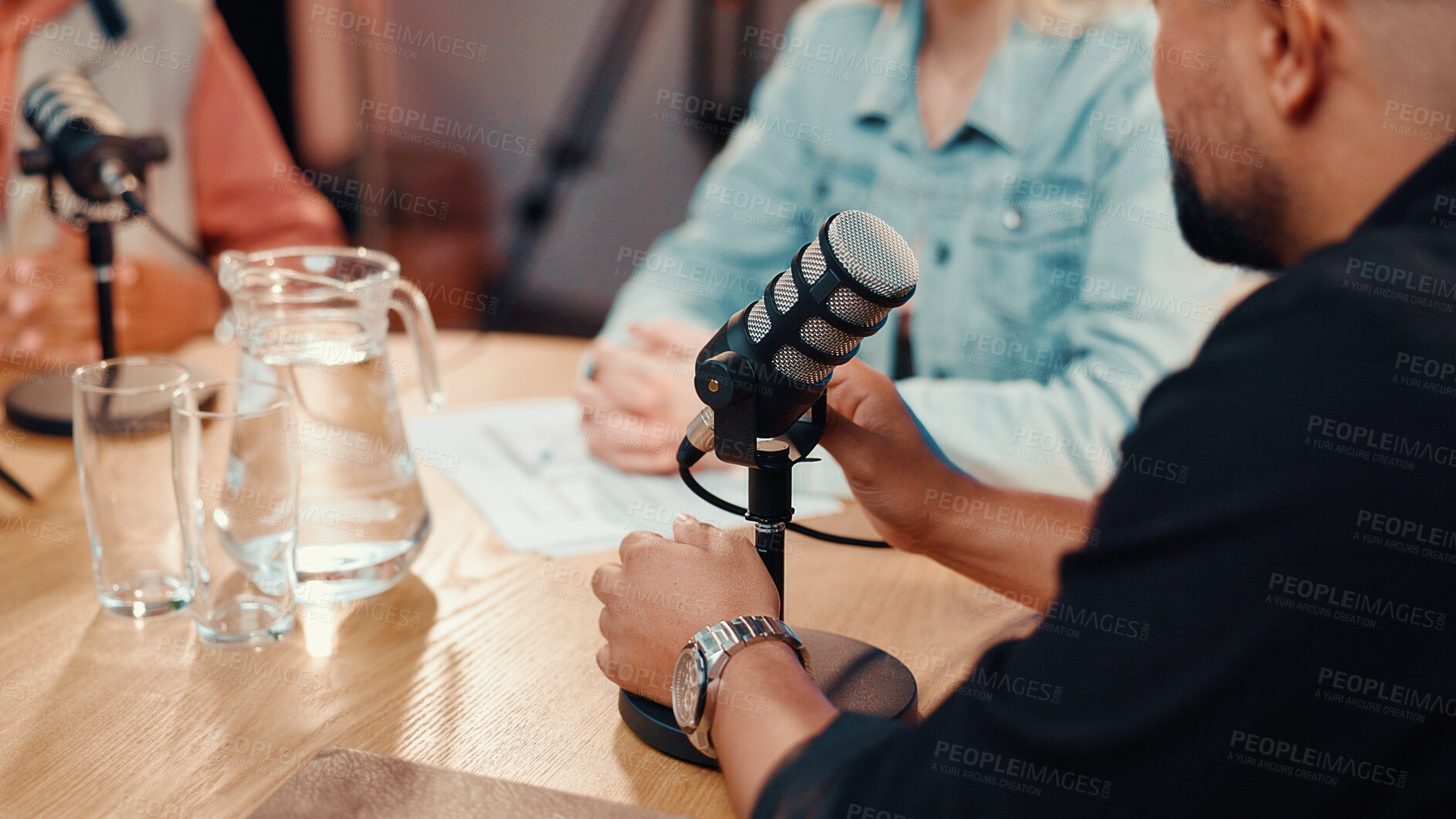 Buy stock photo Podcast, mic and people in home studio for interview, questions or debate on culture review. Presenter, guests and talk show with streaming, notes or networking conversation for online news broadcast