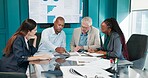 Meeting, feedback and business people in office with paperwork for finance proposal in collaboration. Team, documents and manager with financial advisors for review on investment plan in workplace.