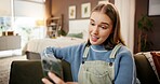 Cellphone, video call and woman on sofa in home with communication, contact or networking online. Happy, waving and female person with virtual conversation on phone in living room at apartment.