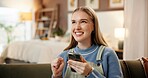 Phone, fist pump and woman on sofa in home with winning, bonus or prize for online gambling. Happy, technology and female person on cellphone with celebration for lottery announcement in house.