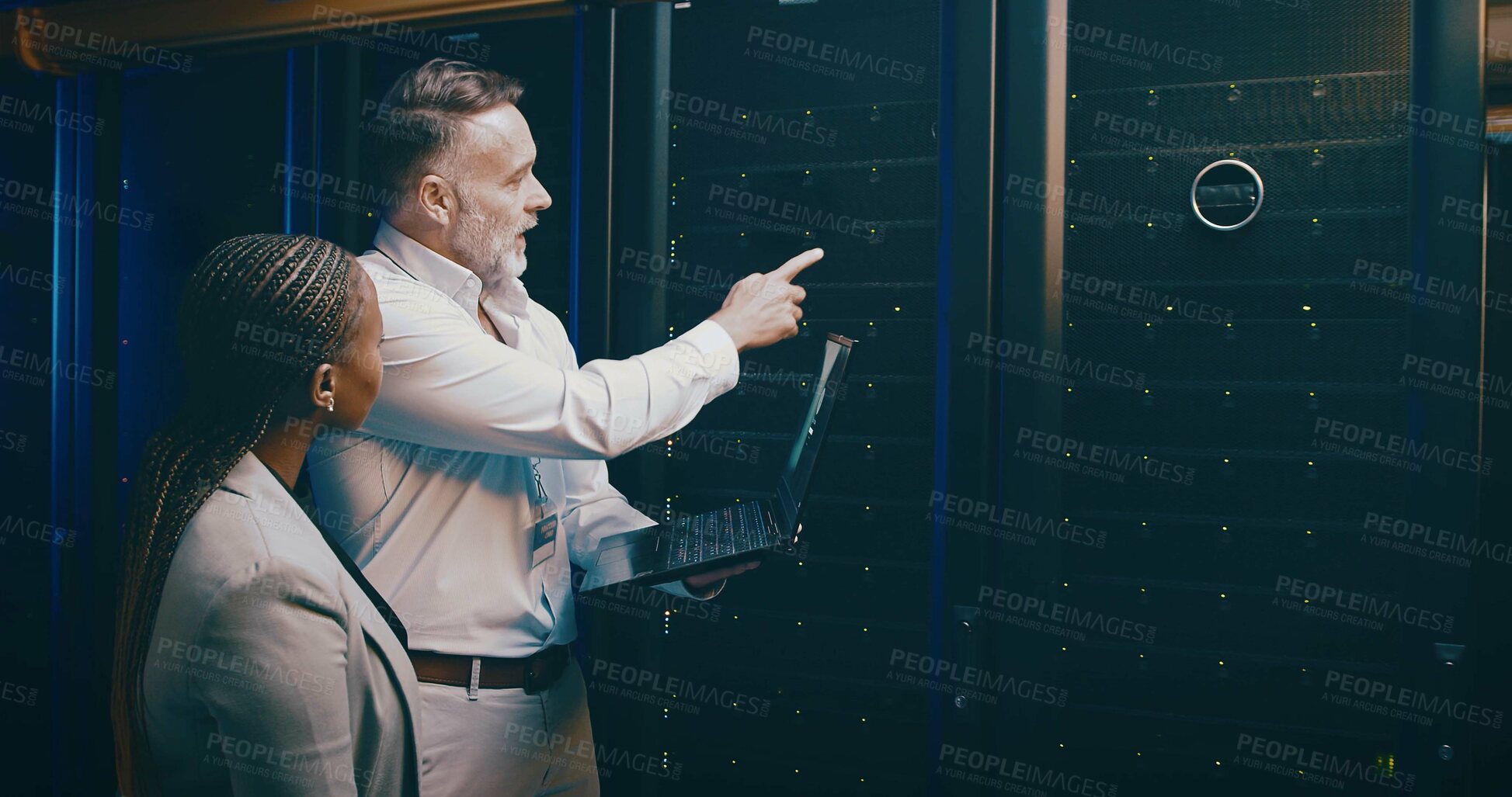 Buy stock photo People, cyber security and laptop in server room, pointing and programming with teamwork. IT specialist, technical support and employees with hardware upgrade, problem solving and inspection with PC