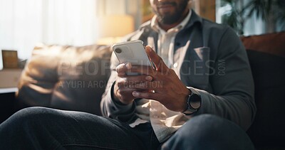 Buy stock photo Sofa, typing and man with phone on social media, online connection and text message on weekend. Living room, relaxing and hands of person on smartphone for website, contact and communication in home